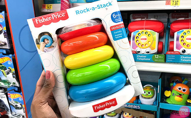 Hand Holding Fisher Price Baby Toy Gift Set with Rock a Stack Ring Stacking Toy