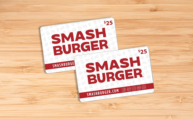 Two Counts of Smashburger Gift Cards on a Wooden Table