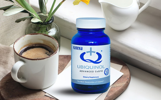 Ubiquinol CoQ10 Supplement Bottle on a Table next to Coffee Cup