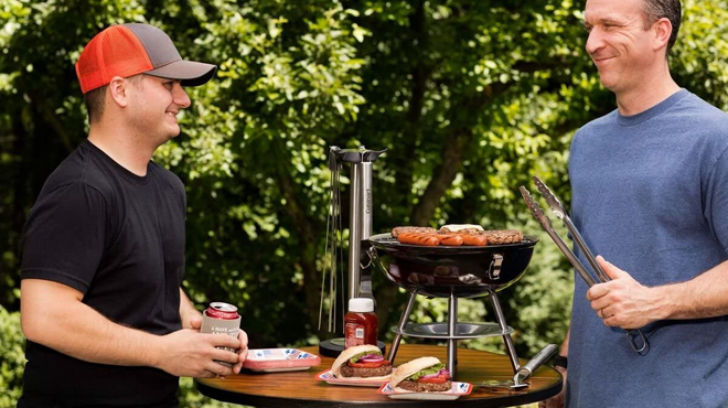 Men Grilling on Cuisinart Portable Charcoal Grill