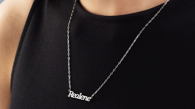 Person Wearing Zales Personalized Silver Necklace with the Name Realene