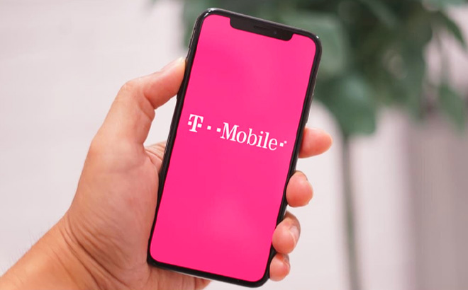 Hand Holding a Phone with T-Mobile on Screen