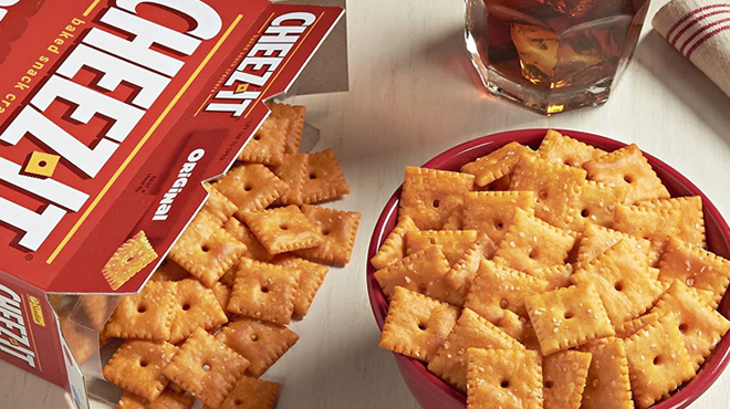 A Box of Cheez It Crackers on a Table and Some Crackers Inside a Bowl