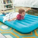 A Boy Laying on the Intex Cozy Kidz Inflatable Airbed in Blue