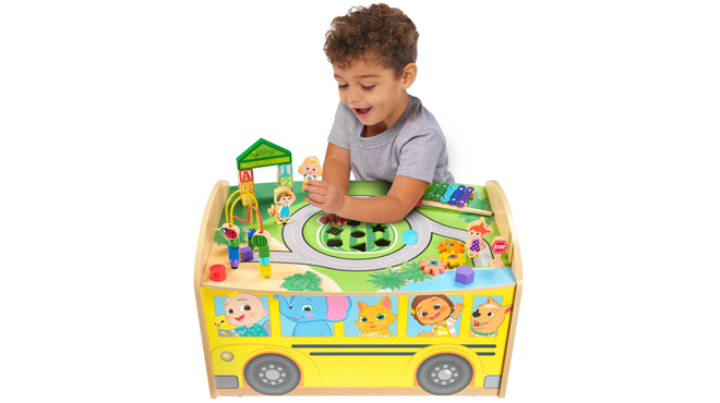 A Boy Playing CoComelon Wheels on the Bus Wooden Activity Table