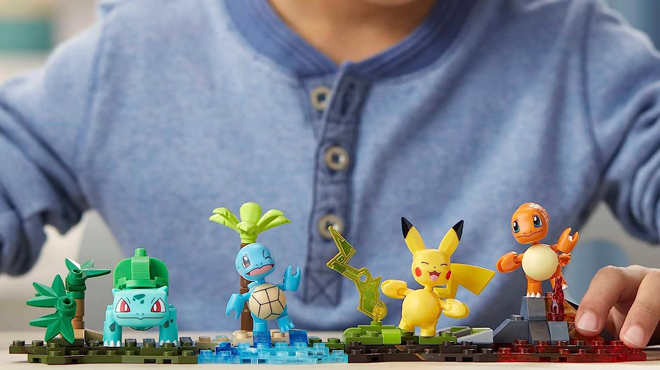 A Child Playing with Mega Pokemon Kanto Region Team Toy Building Set
