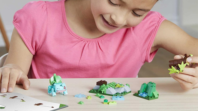 A Girl PLaying Mega Pokemon Bulbasaurs Forest Fun Building Set