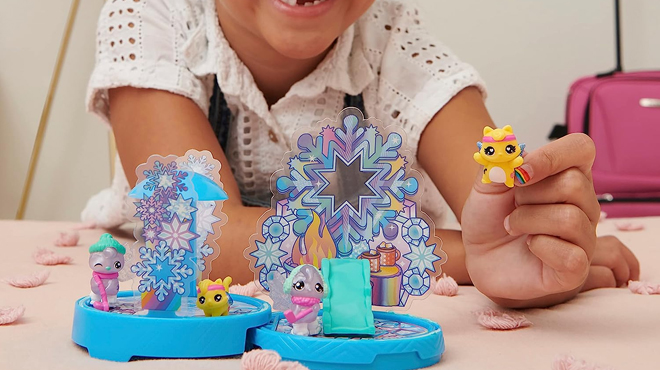 A Girl Playing Hatchimals CollEGGtibles Rainbow Cation Playset