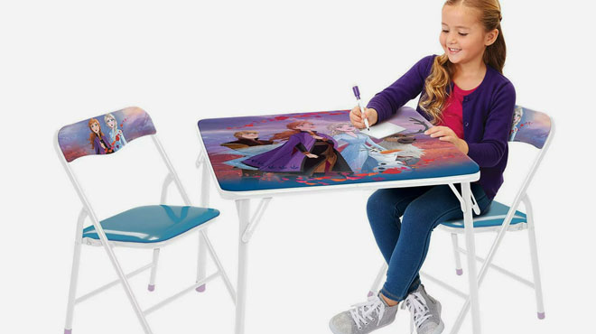 A Girl Writting on a Disney Frozen 2 Kids Erasable Activity Table