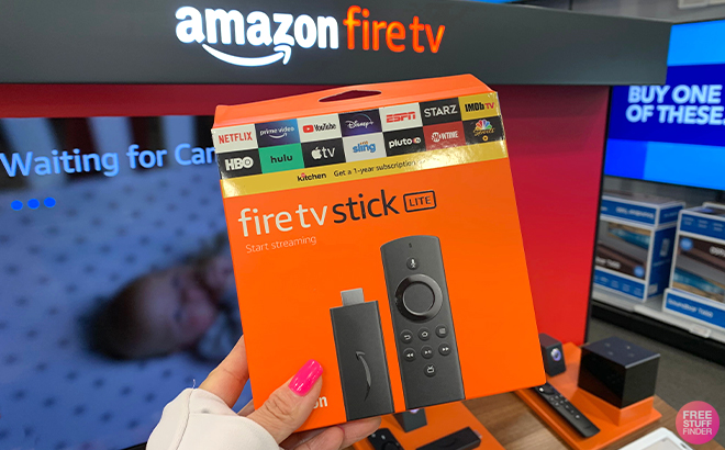 A Hand Holding Amazon Fire TV Stick Lite