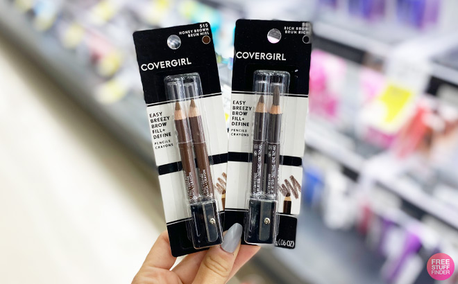 A Hand Holding Cover Girl Easy Breezy Brow Pencils