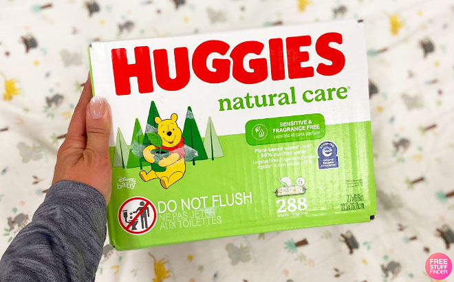 A Hand Holding Huggies Natural Cary Baby Wipes 288 Count