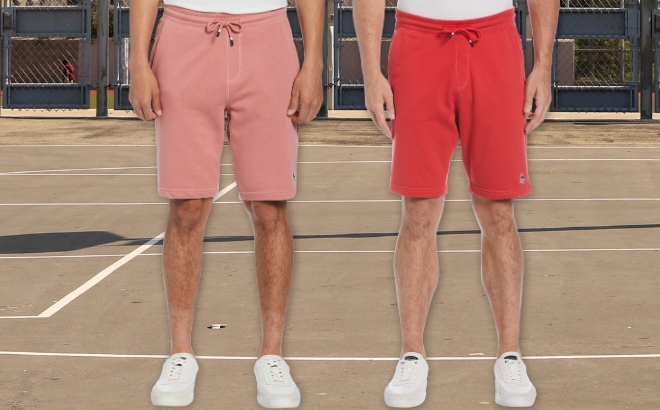 A Men Wearing the Original Penguin Fleece Shorts in Salomon on the Left and Red on the Right