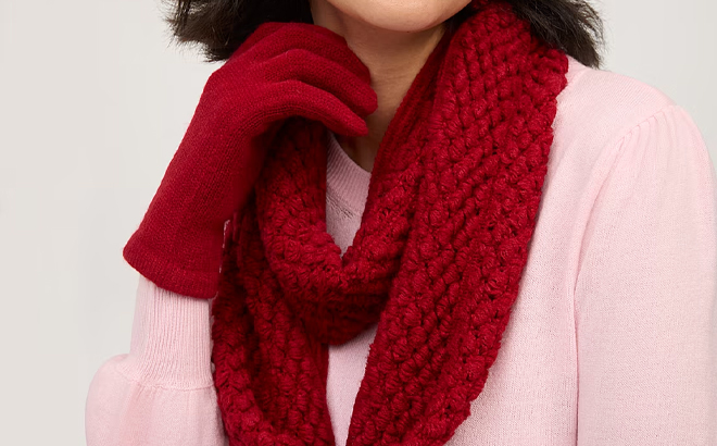 A Model Wearing New York Company 2 Piece Knit Scarf and Gloves Set in Wild Berries Color