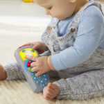 Baby Playing with the Fisher Price Laugh and Learn Toy Pretend TV Control Remote