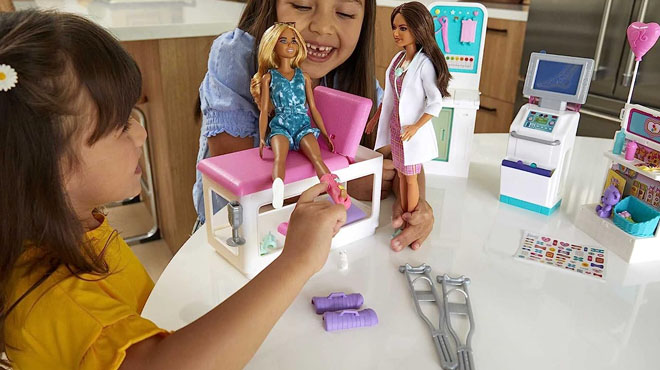 Two Girls Playing With Barbie Fast Cast Clinic Playset Barbie Doctor Doll