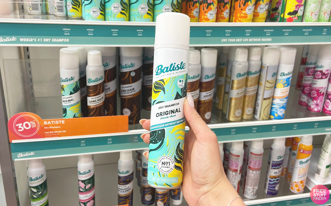 Woman Holding a Batiste Original Dry Shampoo at the Store