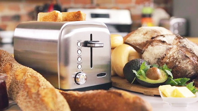 Bella Classics 2 Slice Wide Slot Toaster on a Table Surrounded by Bread