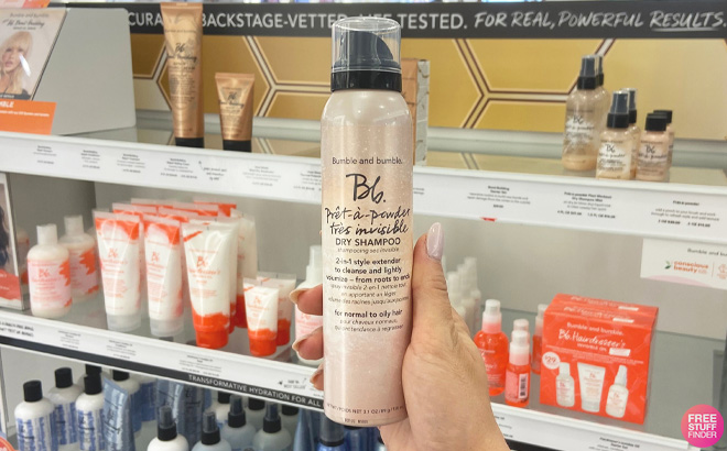 Woman Holding a Can of Bumble and bumble Invisible Dry Shampoo at the Store