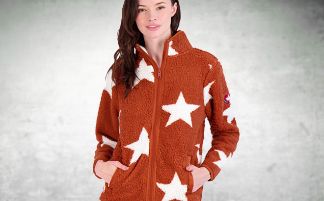 Canada Weather Gear Brown Sherpa Jacket with White Stars in Front of a Grey Wall