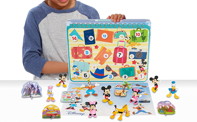 Child Holding Disney Junior Mickey Mouse Vacation Countdown