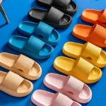 Comfy Anti Slip Slipper Slides Six Different Colors on a Blue Floor