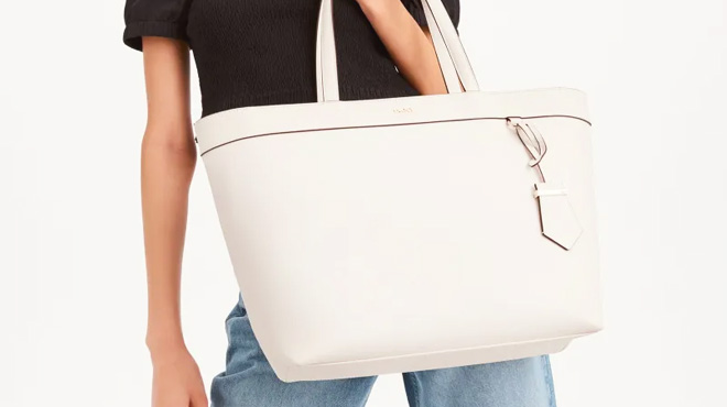 Woman Holding a White DKNY Wendy Tote