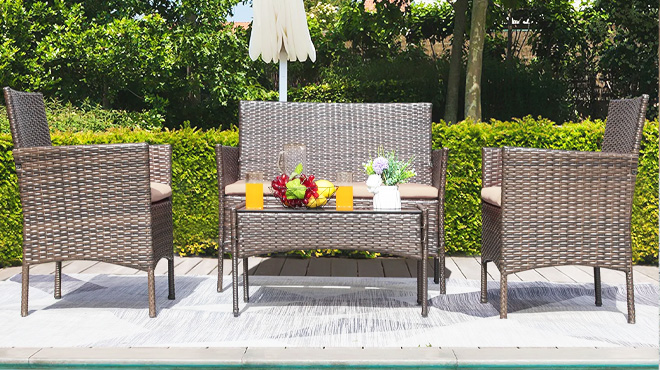 Donn Polyethylene Wicker 4 Person Seating Group with Cushions beside a pool