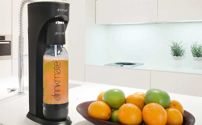 Drinkmate OmniFizz Countertop Carbonated Beverage Maker on a Kitchen Counter