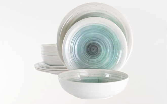 Elama Potters Wheel 12 Piece Melamine Dinnerware Set on a Gray Background