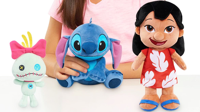 Girl Holding Disneys Lilo and Stitch 3 Piece Plush Set