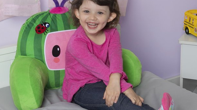 Girl On The Bed Resting on CoComelon Backrest Pillow