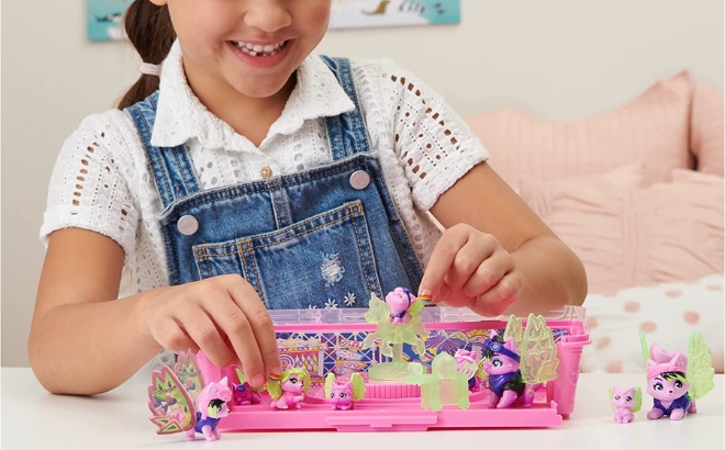 Girl Playing with the Hatchimals CollEGGtibles Rainbow cation Wolf Family Carton Playset Open