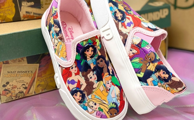 Ground Up Disney Princesses Slip On Sneakers onGround Up Disney Princesses Slip On Sneaker for Toddlers Next to Some Shoeboxes