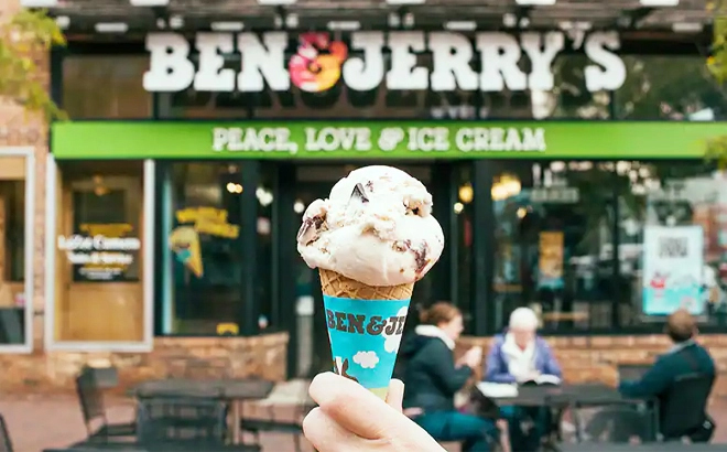 Hand Holding Ben Jerrys Ice Cream Cone 1