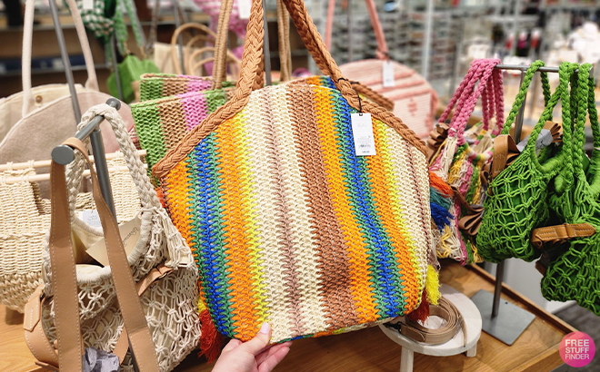 Hand Holding Shade Shore Straw Tote Handbag in Multicolor