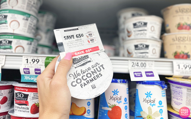 Hand Holding So Delicious Dairy Free Yogurt and Coupon
