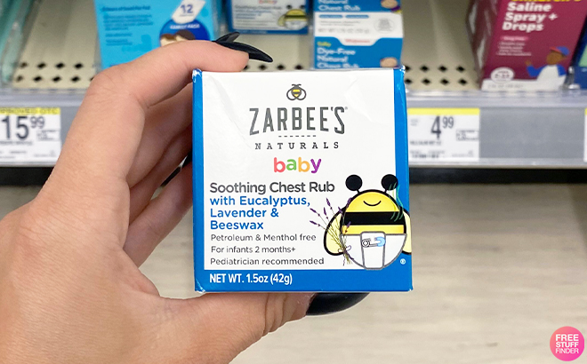 Hand Holding Zarbees Baby Chest Rub at Walgreens