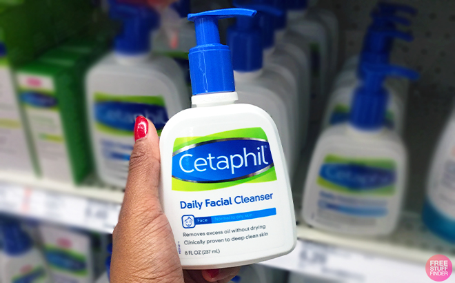 Hand holding 8 Ounce Cetaphil Face Cleanser