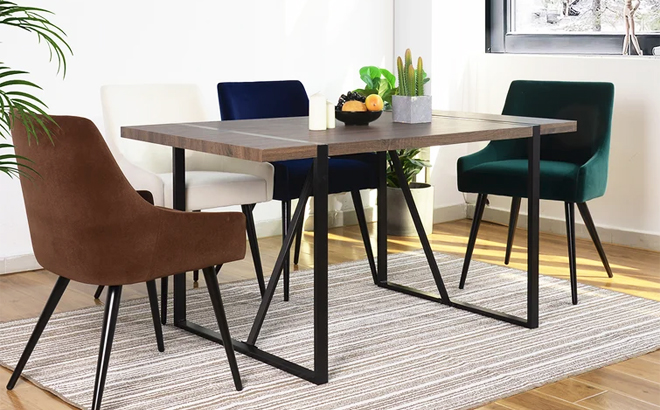 Hughes Dining Table Surrounded by Colofur Chairs