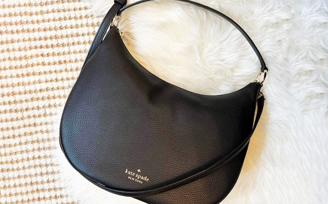 Kate Spade Weston Shoulder Bag in Black Color on a Fuzzy Blanket