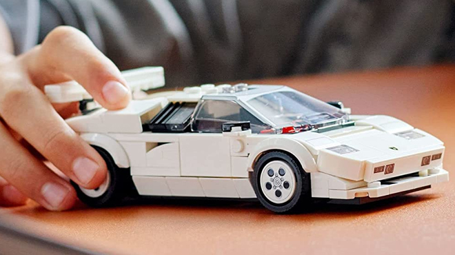 Kid Playing with the LEGO Speed Champions Lamborghini Countach Car