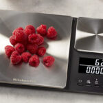 KitchenAid Digital Food Scale with Berries on a Kitchen Countertop with Some Foods