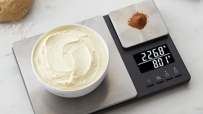 KitchenAid Digital Food Scale with Cream and Cocoa Powder on a Kitchen Countertop