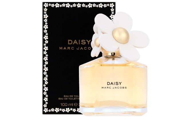 Marc Jacobs Daisy Eau de Toilette Womens Perfume Box in the Back Left and the Bottle in the Front Right on a White Background