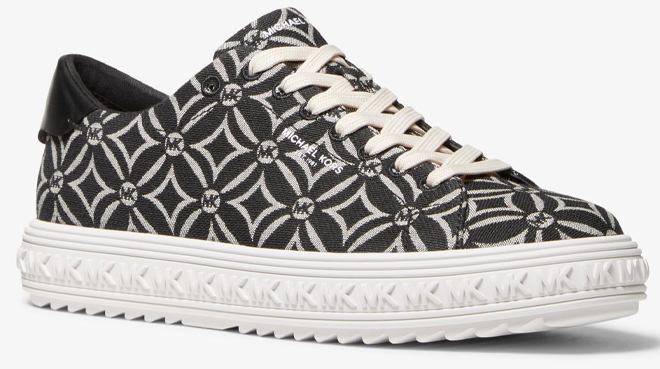 Michael Kors Grove Logo Jacquard Sneaker on a Gray Background Michael Kors Grove Logo Jacquard Sneaker on a Gray Background