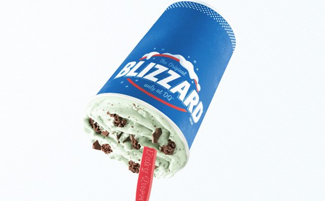 Upside Down Cup of Dairy Queen Mint Brownie Blizzard on a Light Striped Background