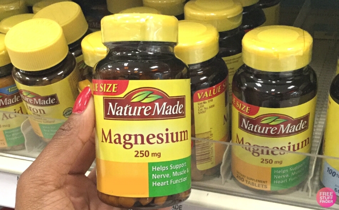 Nature Made Magnesium Oxide 250 mg 100 Count Bottle Held in Hand in a Store