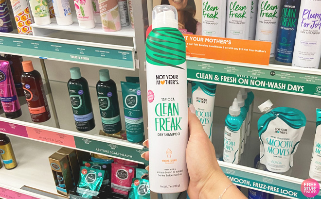 Woman Holding a Not Your Mothers Dry Shampoo at the Store
