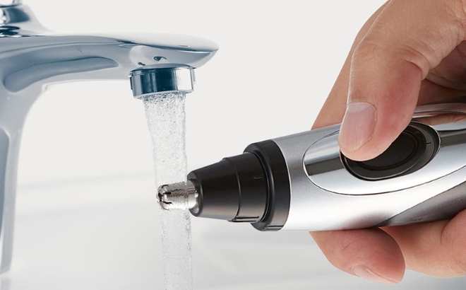 Panasonic Nose Ear and Facial Hair Trimmer Being Washed In The Bathroom Sink Tap